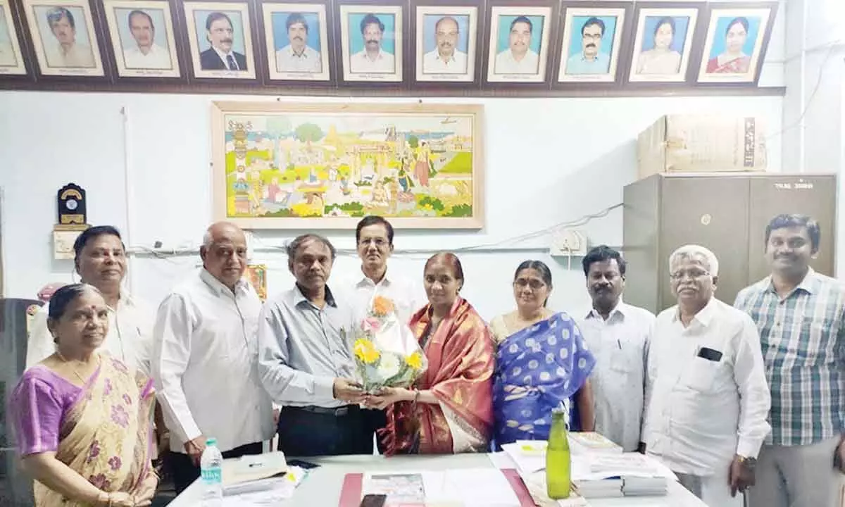 Prof R Rajeswaramma being congratulated by Prof M Ravikumar and others in Tirupati on Monday.
