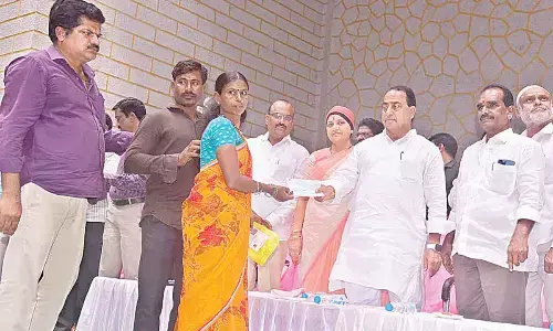 Forest Minister Allola Indrakaran Reddy distributing Kalyana Lakshmi cheques to beneficiaries in Nirmal on Tuesda