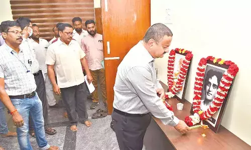 District Collector K Venkata Ramana Reddy offering tributes to the portraits of Pingali Venkayya and Bellari Raghava in Tirupati on Tuesday
