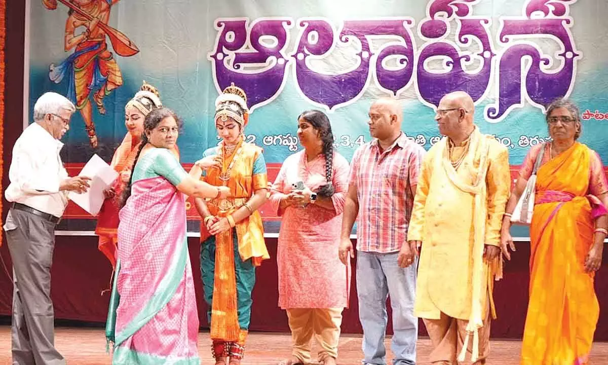 Aalapana organisers felicitating NRI Murra sisters after their Kuchipudi performance at Mahati Auditorium in Tirupati on Wednesday.