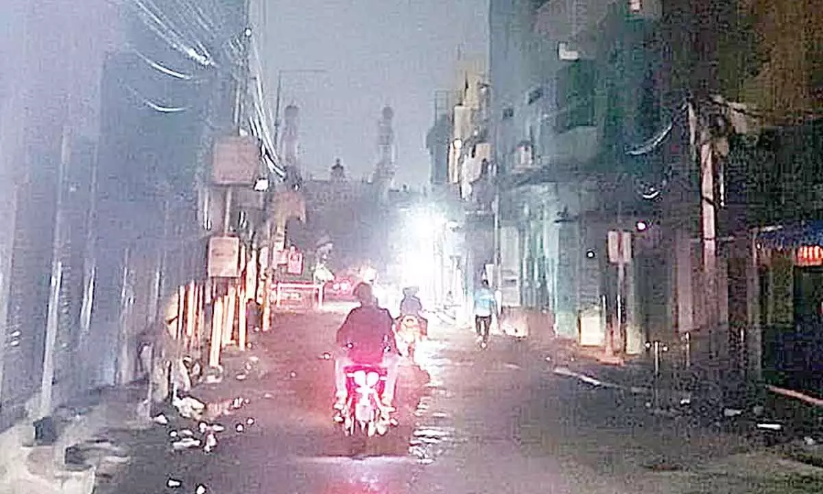 Road From Charminar To Panjesha: Pedestrians grope in the dark