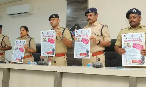 Guntur Urban SP K Arif Hafeez, Additional SP (Admn) K Supraja, Additional SP (Crimes) Srinivasa Rao, DAR Additional SP Koteswara Rao and Special Branch Circle Inspector Srinivasa Rao releasing posters to create awareness on cybercrimes in Guntur on Wednesday