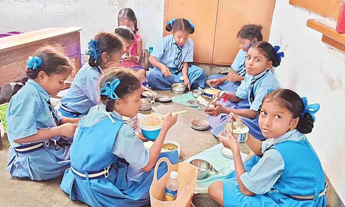 Students of Visakha Vimala Vidyalayam School having lunch at the campus in Visakhapatnam