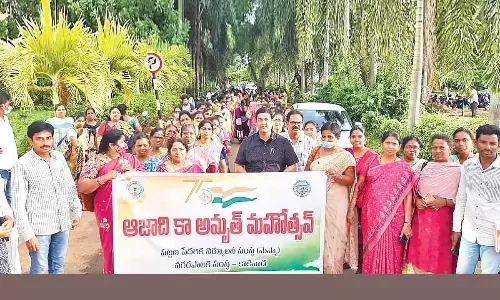 KMC Commissioner K Ramesh Babu, district officials and others participating in a rally in Kakinada on Thursday
