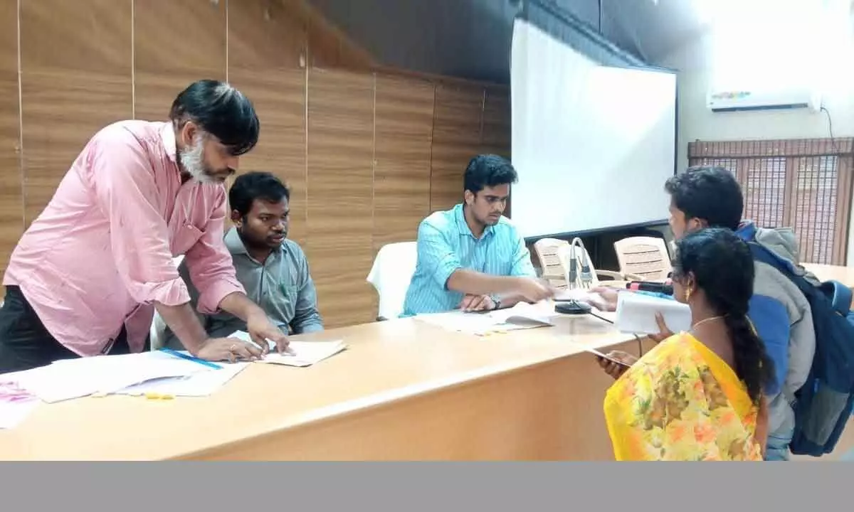 Polavaram project R&R Package Administrative Officer Praveen Aditya receiving applications from the expatriates of Polavaram project, at ITDA Hall in Rampachodavaram on Friday