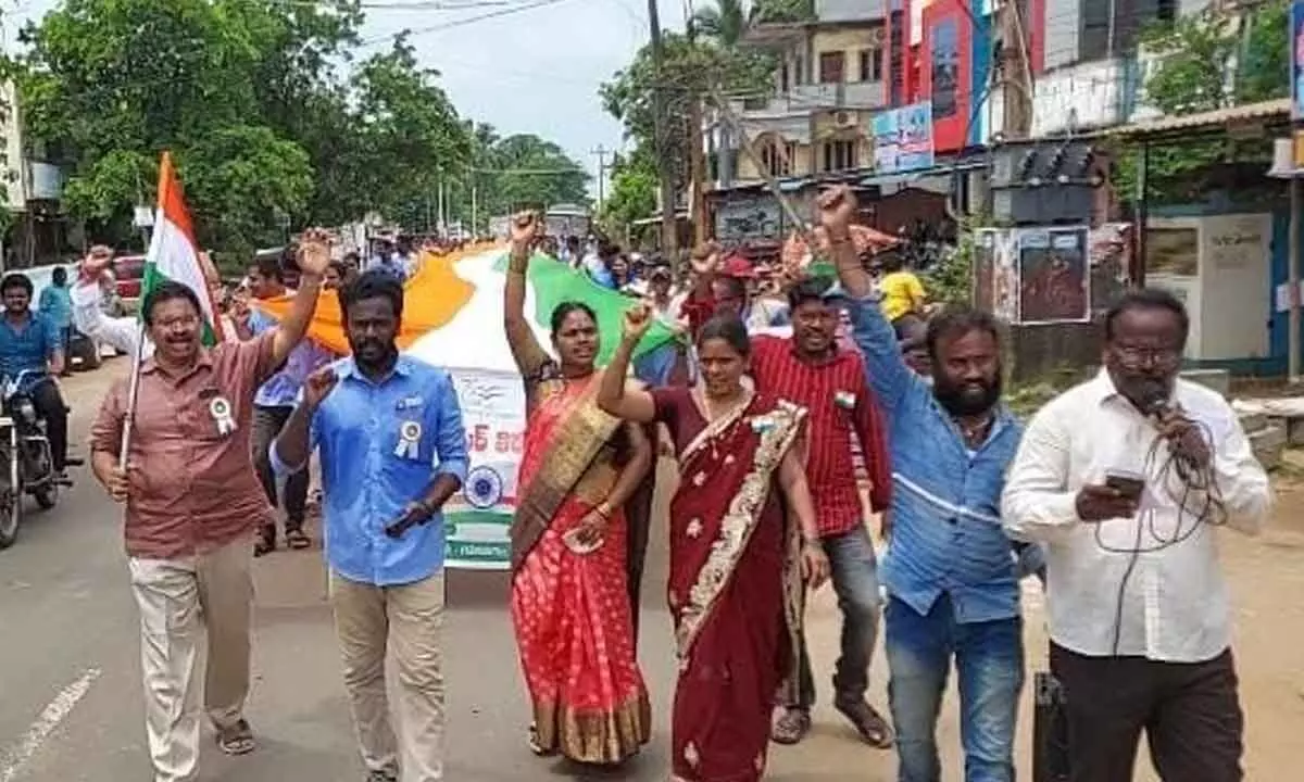 Secretariat staff taking out a rally with a 300-feet national flag in Gokavaram on Friday