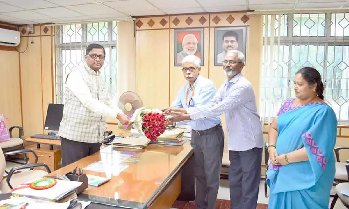 NSU Registrar Commander Challa Venkateswar greeting the new  V-C Prof E Suresh Kumar in Tirupati on Saturday.