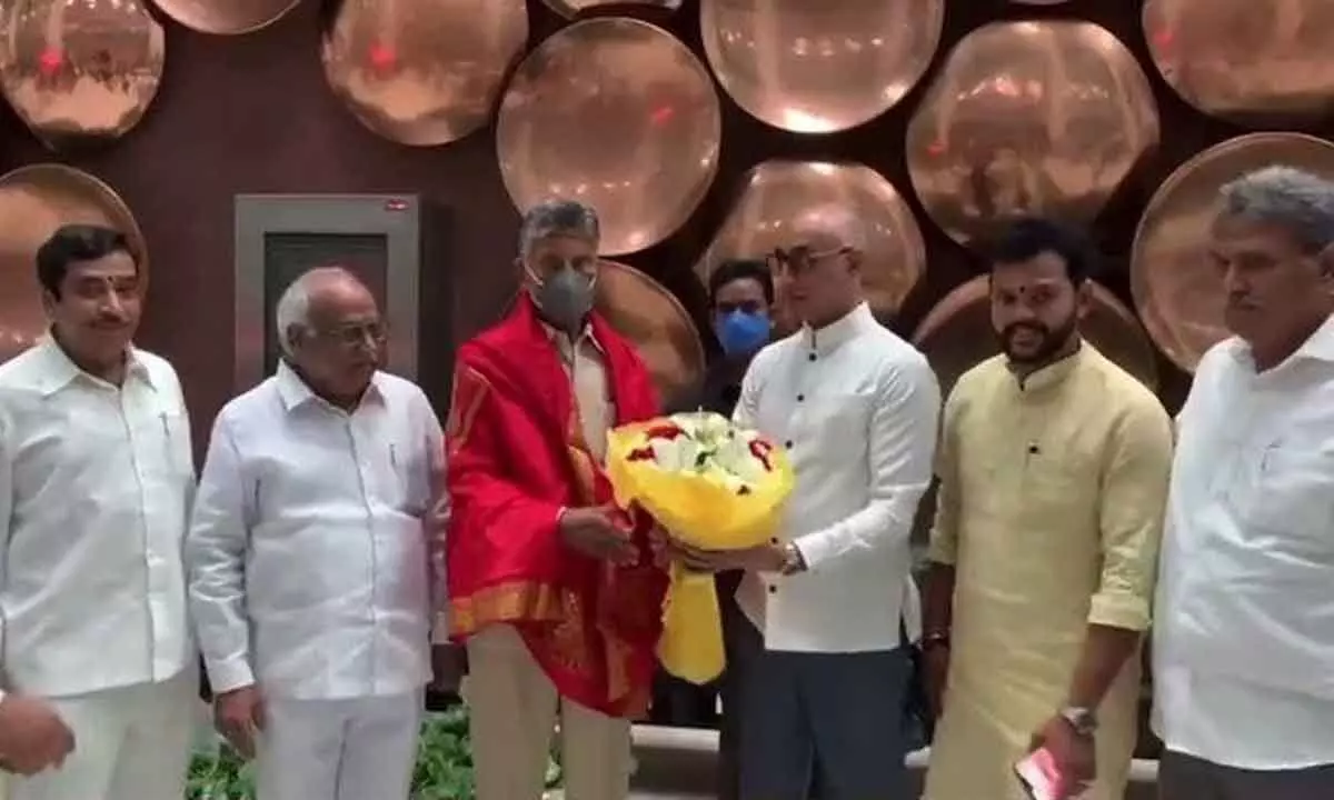 Guntur ML Galla Jayadev givs boquet to TDP president N Chandrababu Naidu along with other MPs on his arrival at New Delhi on Saturday