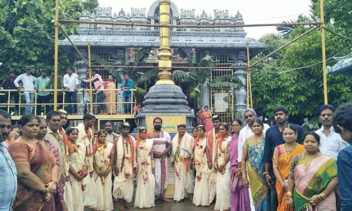 Newly-married couples along with trustees and relatives at  Sri Varaha Lakshmi Narasimha Swamy temple on Sunday