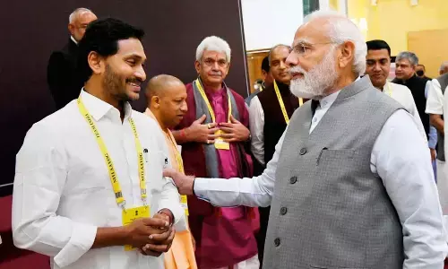 Prime Minister Narendra Modi interacts with Andhra Pradesh CM YS Jagan Mohan Reddy at the 7th Governing Council meeting of NITI Aayog in New Delhi on Sunday
