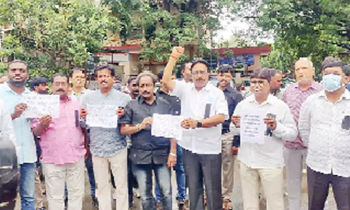 Electricity engineers and workers staging protest in Khammam on Monday