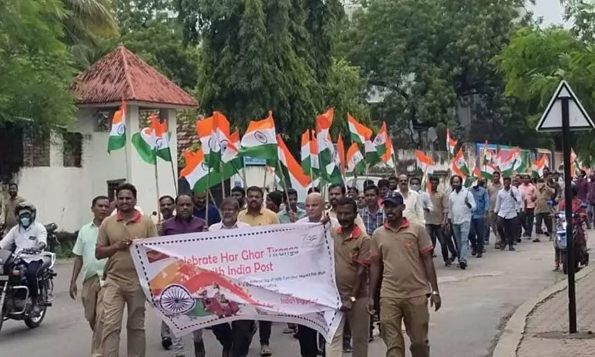 Postal department officials taking  out a rally in Karimnagar on Monday