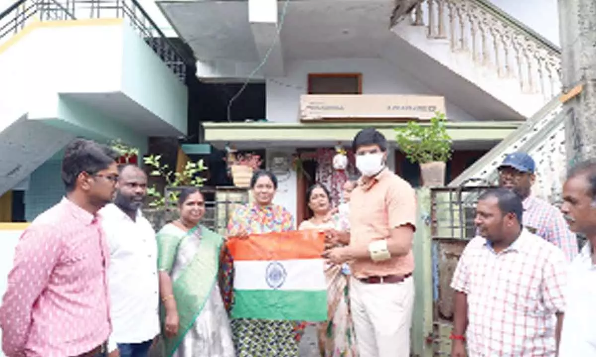 District Collector VP Gautham distributing flags Khammam on Tuesday