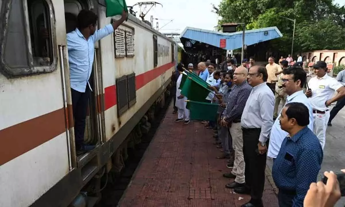 Railway personnel flagging off Visakhapatnam- Kollam express with LHB rake in Waltair