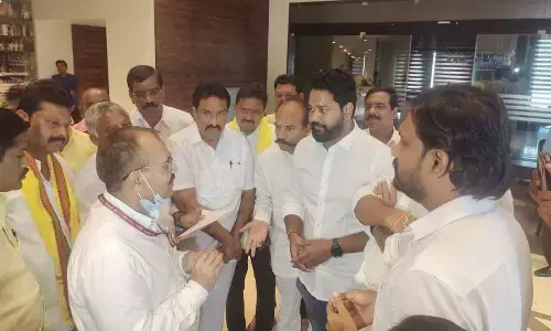 Officials preventing the TDP leaders from meeting the Central team at Manjeera Hotel in Rajahmundry on Thursday