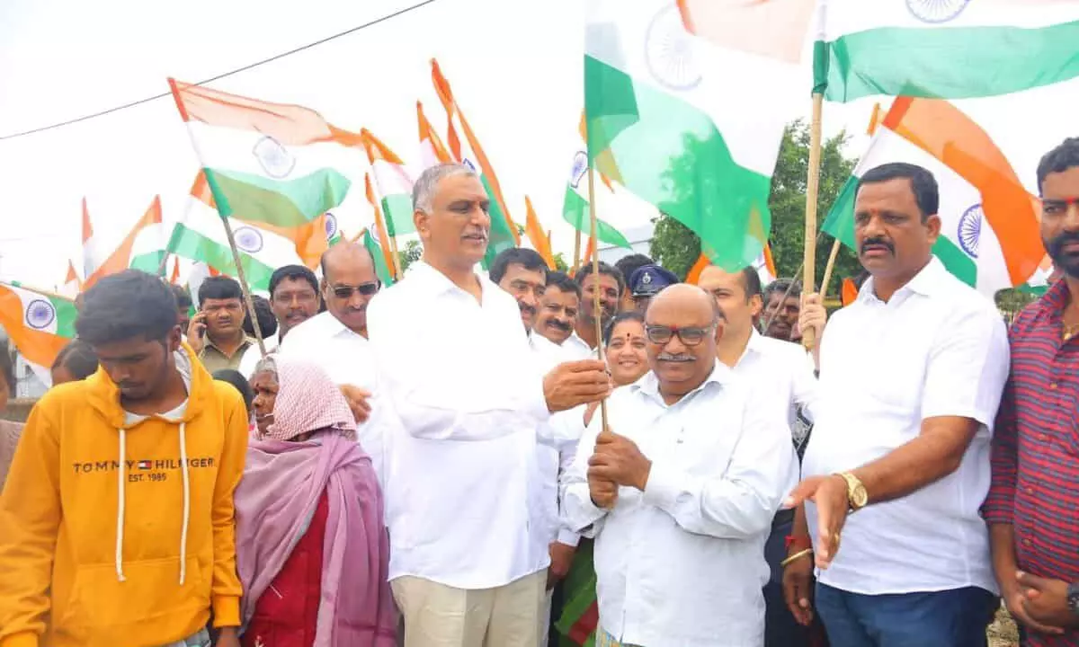 Minister Harish Rao, distributing National Flags as part of celebration of 75 years of independence.