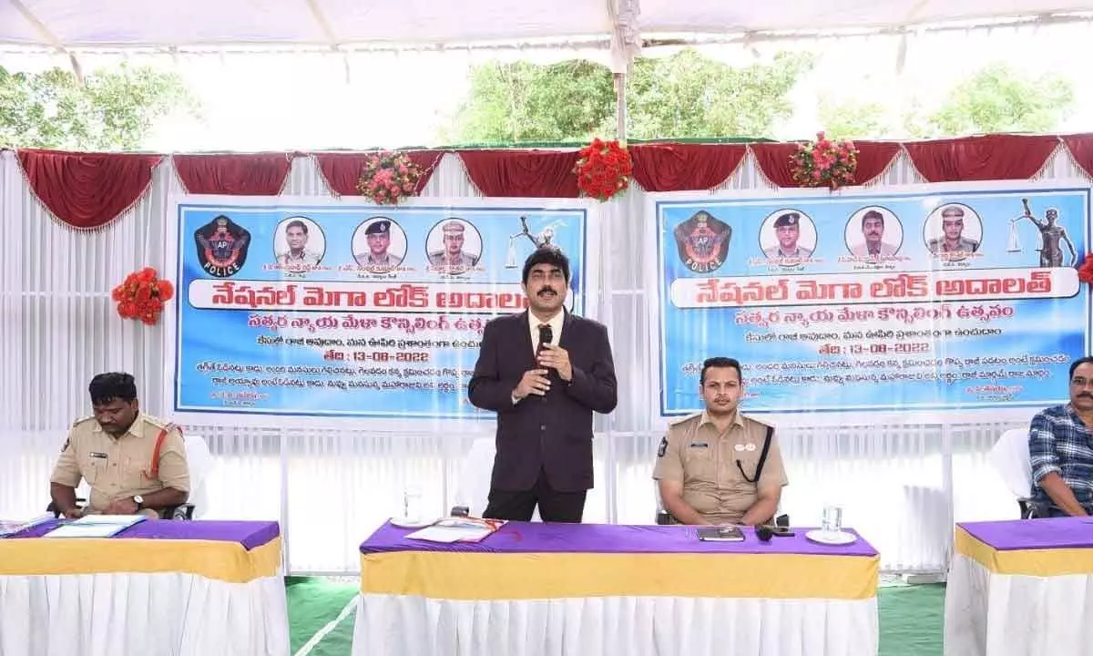 District Legal Services Authority (DLSA) convener and senior civil judge Ch VS Srinivasa Rao addressing the litigants at Mega Lok Adalat organised at taluka police station in Kurnool on Friday. Superintendent of Police Siddarth Kaushal is also seen.
