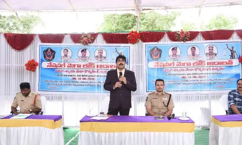 District Legal Services Authority (DLSA) convener and senior civil judge Ch VS Srinivasa Rao addressing the litigants at Mega Lok Adalat organised at taluka police station in Kurnool on Friday. Superintendent of Police Siddarth Kaushal is also seen.