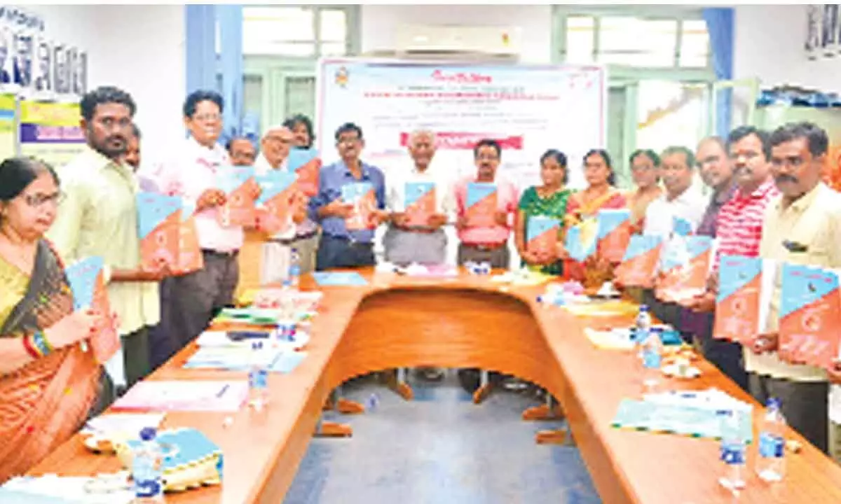 Rayalaseema Economic Association conference brochure being released by Prof A Ranga Reddy, Prof K Munirtathnam Naidu, Prof D Krishna Murthy, Prof K Santha Kumari, Dr K Radhika and others at SV University in Tirupati on Saturday.