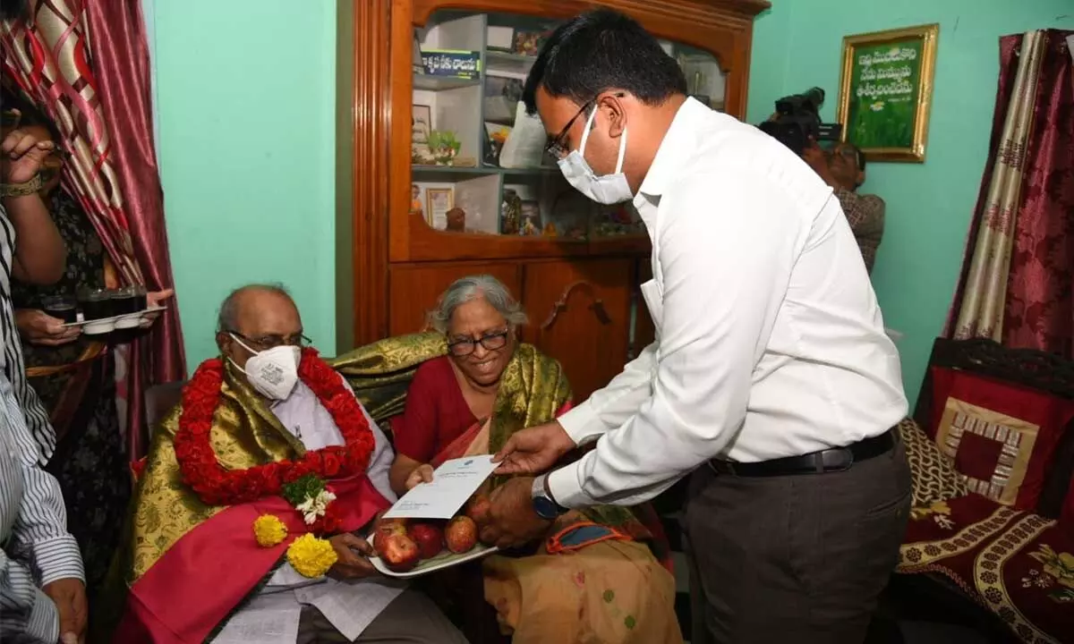 District Collector KVN Chakradhar Babu felicitating  Dr Mukherji, son of freedom fighter T Rayappa,  in Nellore on Sunday