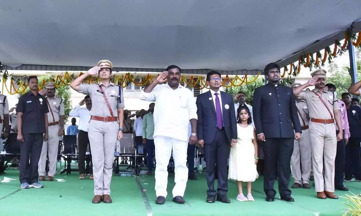 Minister Merugu Nagarjuna, District Collector AS Dinesh Kumar, SP Malika Garg and others saluting to the national flag at Independence Day celebrations in Ongole on Monday