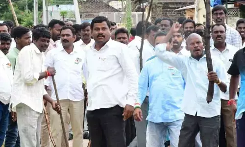 Some people ready with sticks at Bandi Sanjays Padayatra at Devaruppula in Jangaon district on Monday