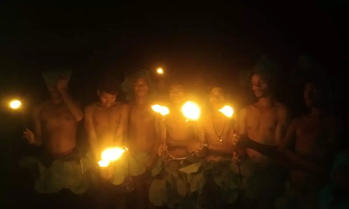 The tribals of China Konela celebrating Jana Jagarana on Independence Day in the light of Kagadas on Monday