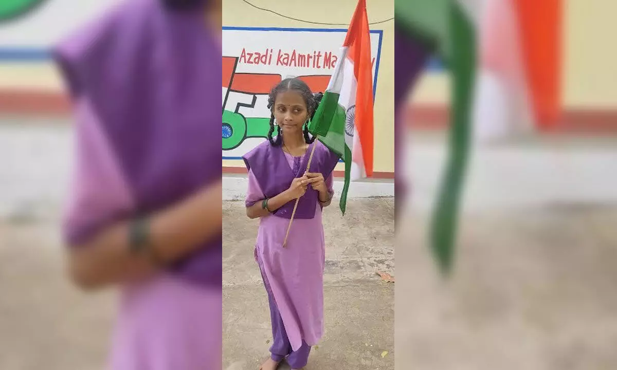 Visually impaired student Suggu Madhuri with the national flag in Visakhapatnam