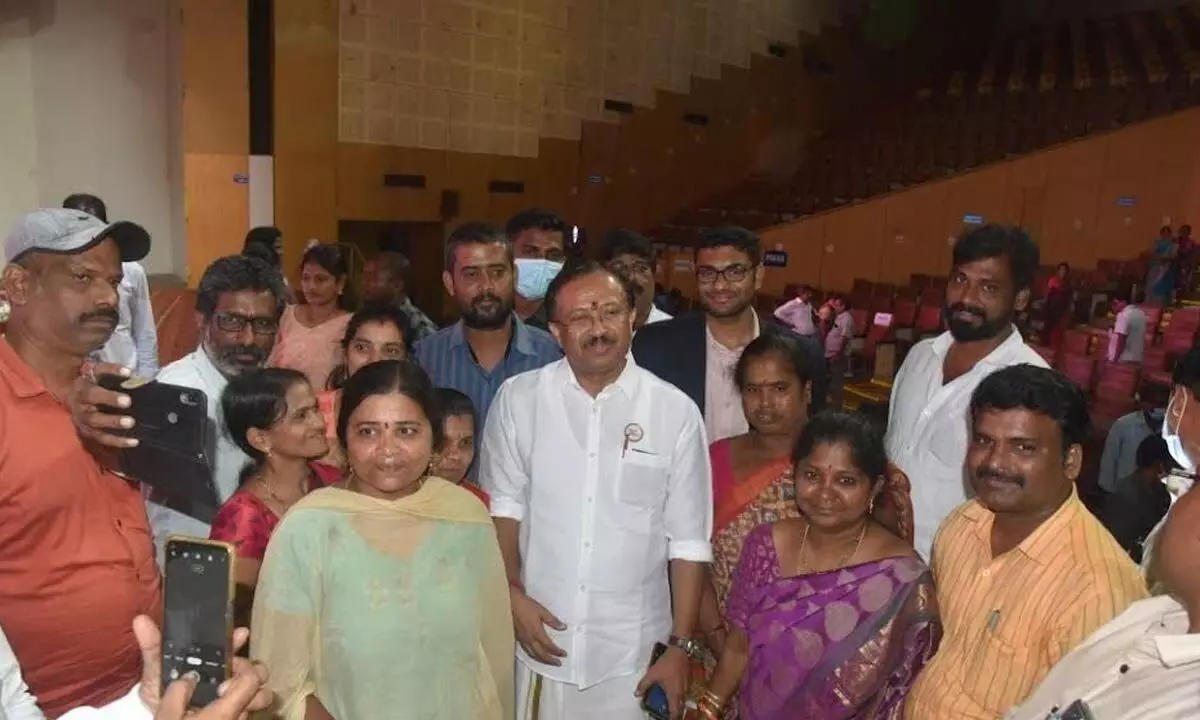 Minister of State for External Affairs and Parliamentary Affairs V Muraleedharan with beneficiaries in Visakhapatnam on Tuesday