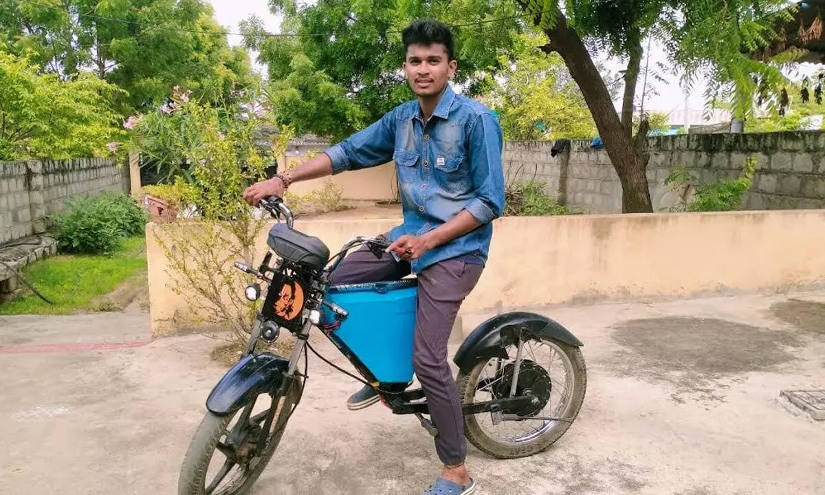 Pendem  Ajay on his own made E-bike