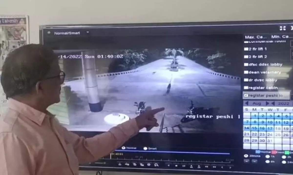 SV Veterinary University Registrar Prof Ravi showing the leopard movement in the campus on CC camera footage in the University in Tirupati on Wednesday.