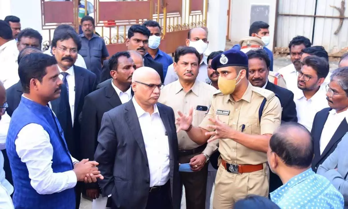 Deputy Commissioner of Police Vishal Gunni explaining the security arrangements to AP High Court Chief Justice Prashant Kumar Mishra, District Collector S Dilli Rao and others at the new court complex in Vijayawada on Wednesday