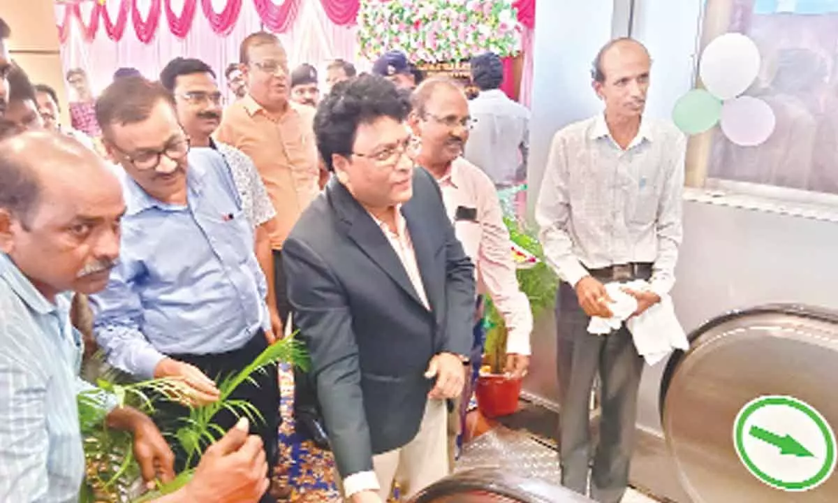 Divisional Railway Manager Anup Satpathy inaugurating escalator facility in Visakhapatnam railway station on Thursday