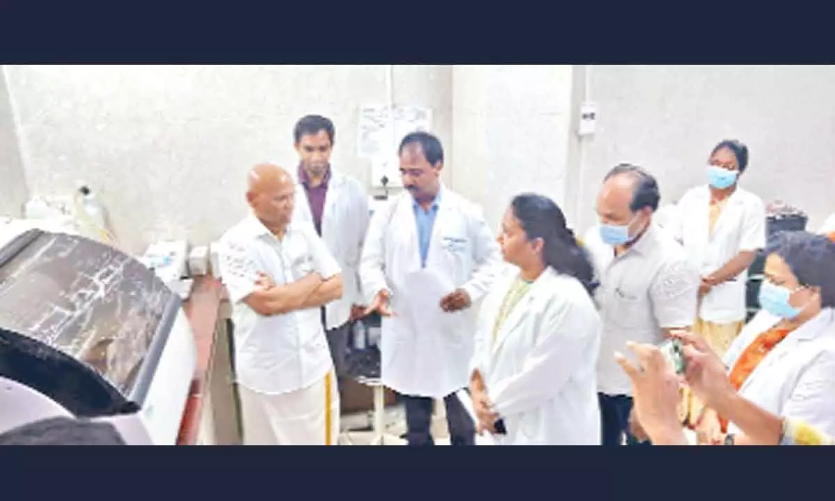 TTD EO A V Dharma Reddy interacting with staff after inauguration of fully automated biochemistry analyser at BIRRD hospital, in Tirupati on Thursday