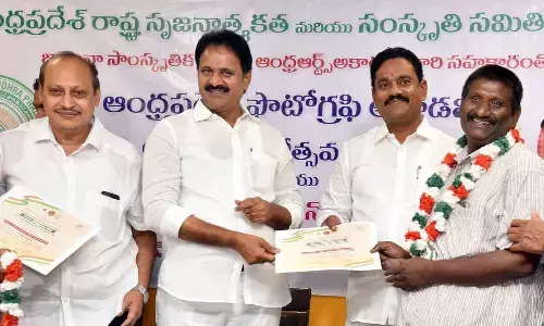 ‘The Hans India’ photographer Challa Venkata Mastan receiving the award from Rajya Sabha Member Mopidevi Venkata Ramana and Chief Whip Mudunuri Prasada Raju at Balotsav Bhavan in Vijayawada on Thursday