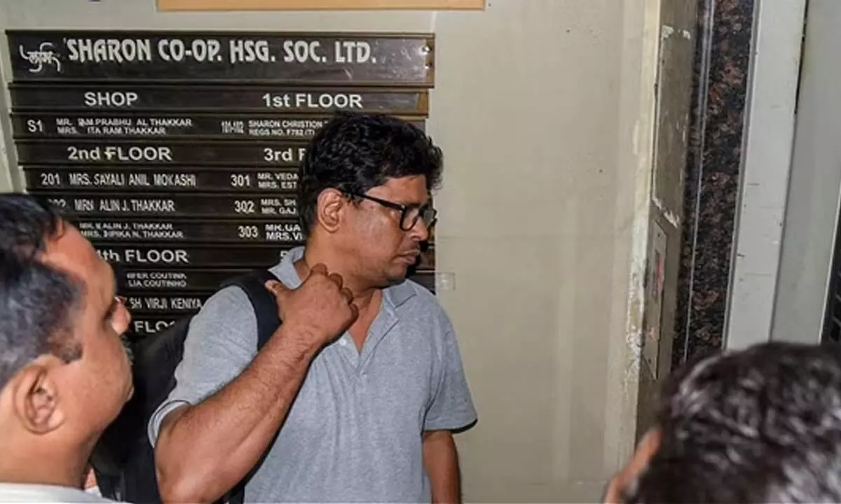 Social activist-lawyer Arun Ferreira looks on after he was brought back to his residence and placed under house arrest in Thane on August 30 2018. (Photo | PTI)