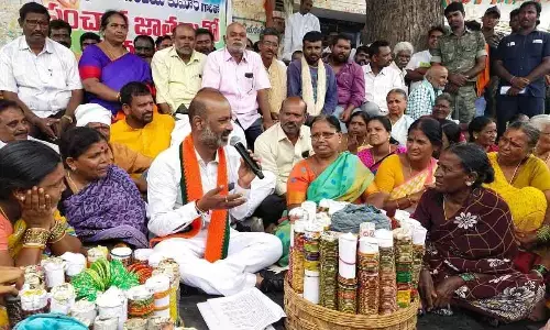BJP State president Bandi Sanjay interacting with the nomadic tribes on the 17th day of his Praja Sangrama Yatra at Chitta Kodur village in Jangaon district on Friday