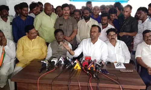 BJP leader Rajagopal Reddy addressing the media in Munugodu on Friday