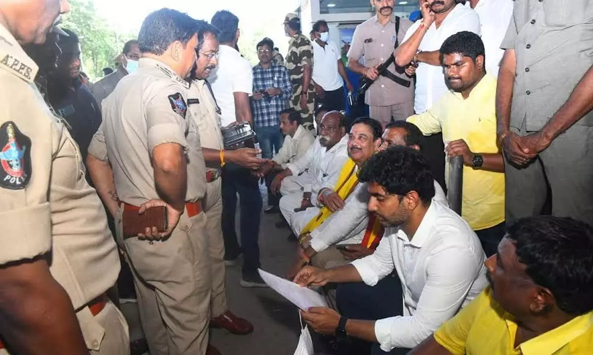 TDP national general secretary Nara Lokesh along with the party leaders staging a sit-in protest at Visakhapatnam Airport on Sunday