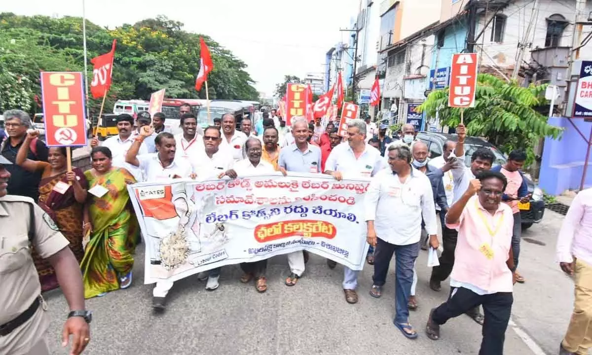 Representatives of trade unions staging a protest against labour codes, in Visakhapatnam on Monday