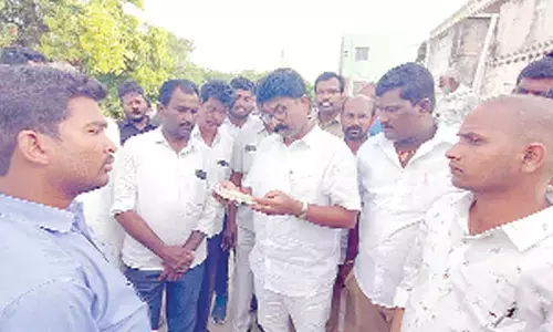 MAUD Minister Audimulapu Suresh interacting with locals at Thokapalli village on Monday