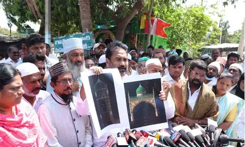 Nellore Rural MLA K Sridhar Reddy displaying design of the arch after laying foundation stone for the works at Barashaheed Dargah in Nellore on Monday