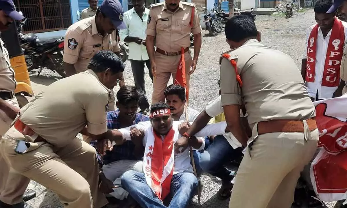 Police forcibly lifting student leaders who tried to barge into collectorate, in Kurnool on Tuesday