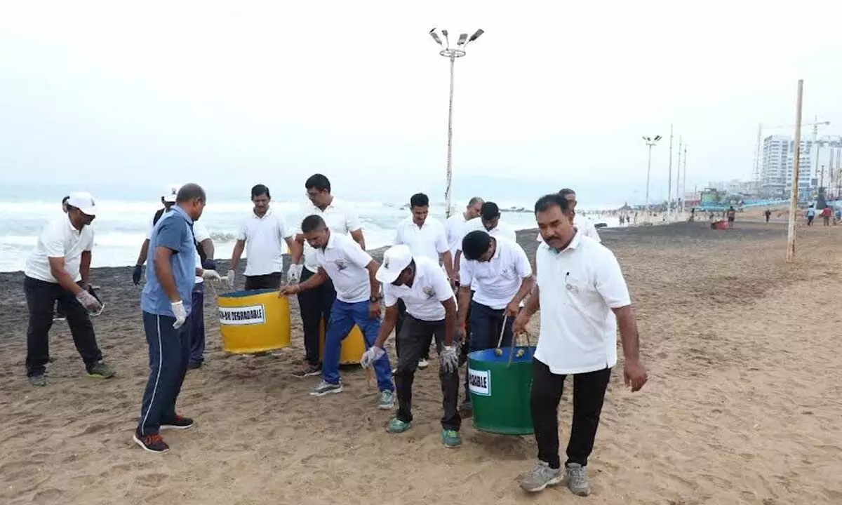 VPA officials taking part in a beach clean-up activity in Visakhapatnam on Tuesday
