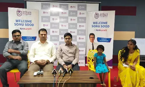 Surgeons (from left) Dr Ravi Kumar, Dr Vinay Kumar and Dr TV Vijay Kumar with the girl addressing the media in Vijayawada on Wednesday