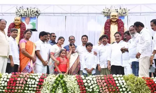 Chief Minister Y S Jagan Mohan Reddy with Buchepally family and senior leaders from YSRCP, after unveiling the statues of Dr YS Rajasekhara Reddy and Buchepalli Subba Reddy in Chimakurthy on Wednesday