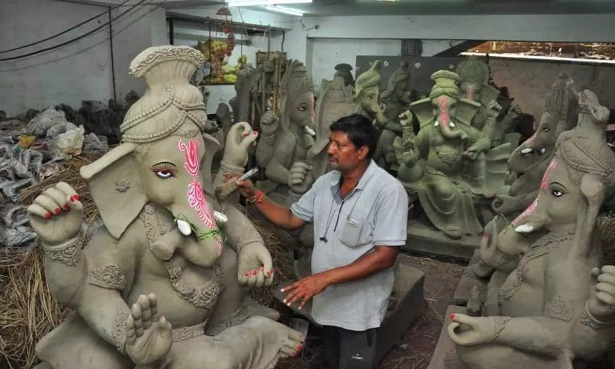 D Narasimha Rao giving final touches to the idols