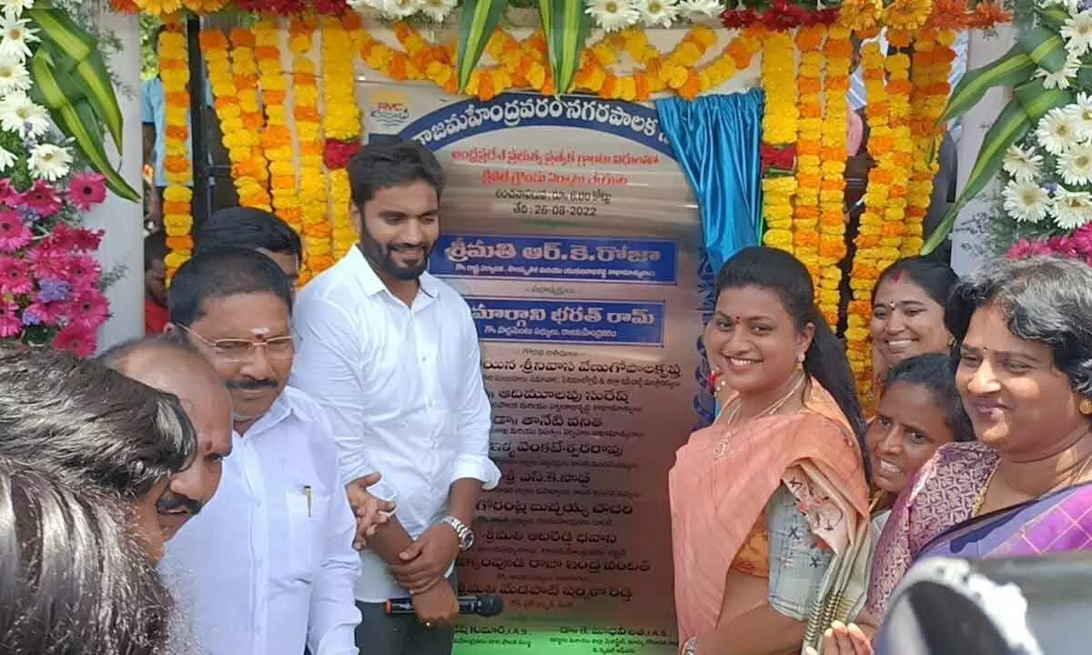 Minister RK Roja laying foundation stone for the construction of cricket ground in Rajamahendravaram on Friday. MP Bharat Ram is also seen.