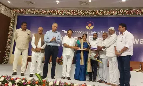 Tobacco Institute of India presenting progressive farmer awards to a tobacco farmer from Andhra Pradesh in Ongole on Friday