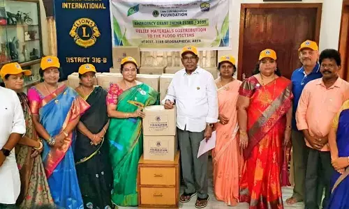 Lions District 316B Governor Maturi Manga Tayaru and her team with relief kits intended for distribution to the flood victims, in Rajamahendravaram on Friday
